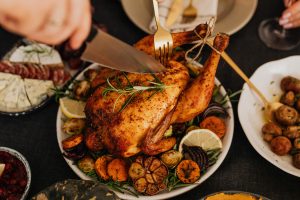 delicious roast chicken getting carved in a luxury house and lot | luxury homes by brittany corporation