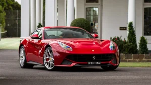 red ferrari f12 berlinetta luxury car luxury homes | luxury homes by brittany corporation