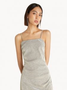 south east asian lady wearing a silver slip dress | luxury homes by brittany corporation