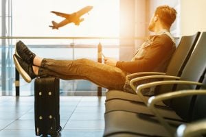 Image of a man chilling in airport lobby | luxury homes by brittany corporation