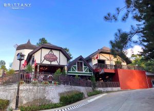 a photo of the facade of the windmill at lausanne | luxury homes by brittany corporation