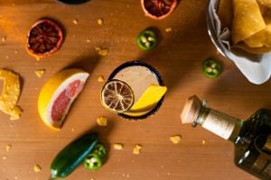 cocktail ingredients displayed on a wooden table stylishly | luxury homes by brittany corporation