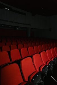 empty cinema with red chairs | luxury homes by brittany corporation