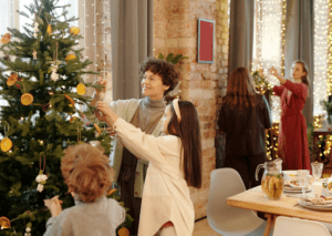 kids fixing the christmas tree in their luxury homes | luxury homes by brittany corporation