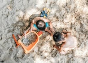 kids playing in the sand | luxury homes by brittany corporation