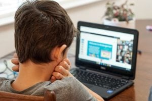 kids using a laptop | luxury homes by brittany corporation