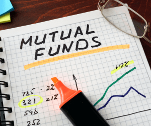 mutual funds photo with paper and pens | luxury homes by brittany corporation