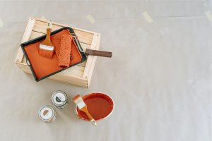 paint and paintbrush set in the color of burnt auburn | luxury homes by brittany corporation