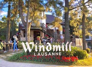 people flock the windmill at lausanne opening day | luxury homes by brittany corporation