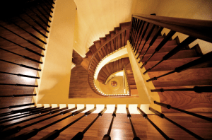 picture of stairs from the top floor making a spiral | luxury homes by brittany corporation