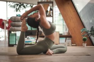 Photo of a woman doing a yoga pose. | luxury homes by brittany corporation