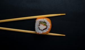 california maki being held by chopsticks | luxury homes by brittany corporation