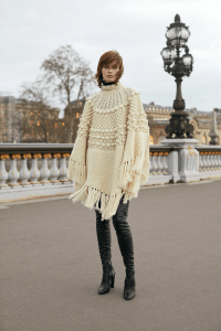 knitted poncho and leather boots on red haired woman | luxury homes by brittany corporation