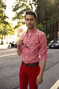 man in red checkered button down shirt and red jeans and brown belt | luxury homes by brittany corporation