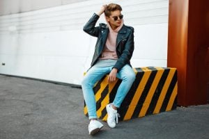 man wearing leather jacket over a hoodies | luxury homes by brittany corporation