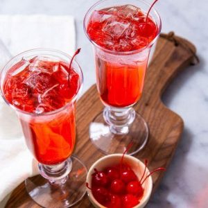 red cherry flavored drink in a fancy glass | luxury homes by brittany corporation