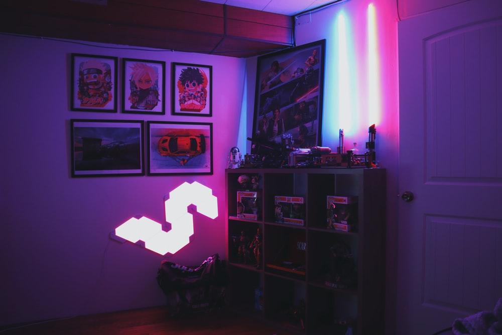 Decorate your gaming room with your favorite games, action figures, and posters. Phot from Unsplash.