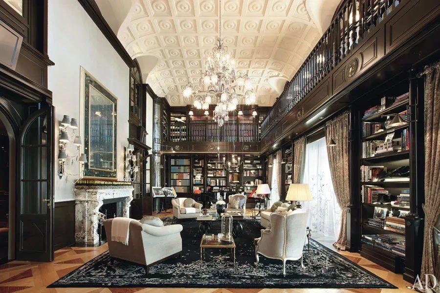 Double height libraries make a grand statement. Photo from Architectural Digest.