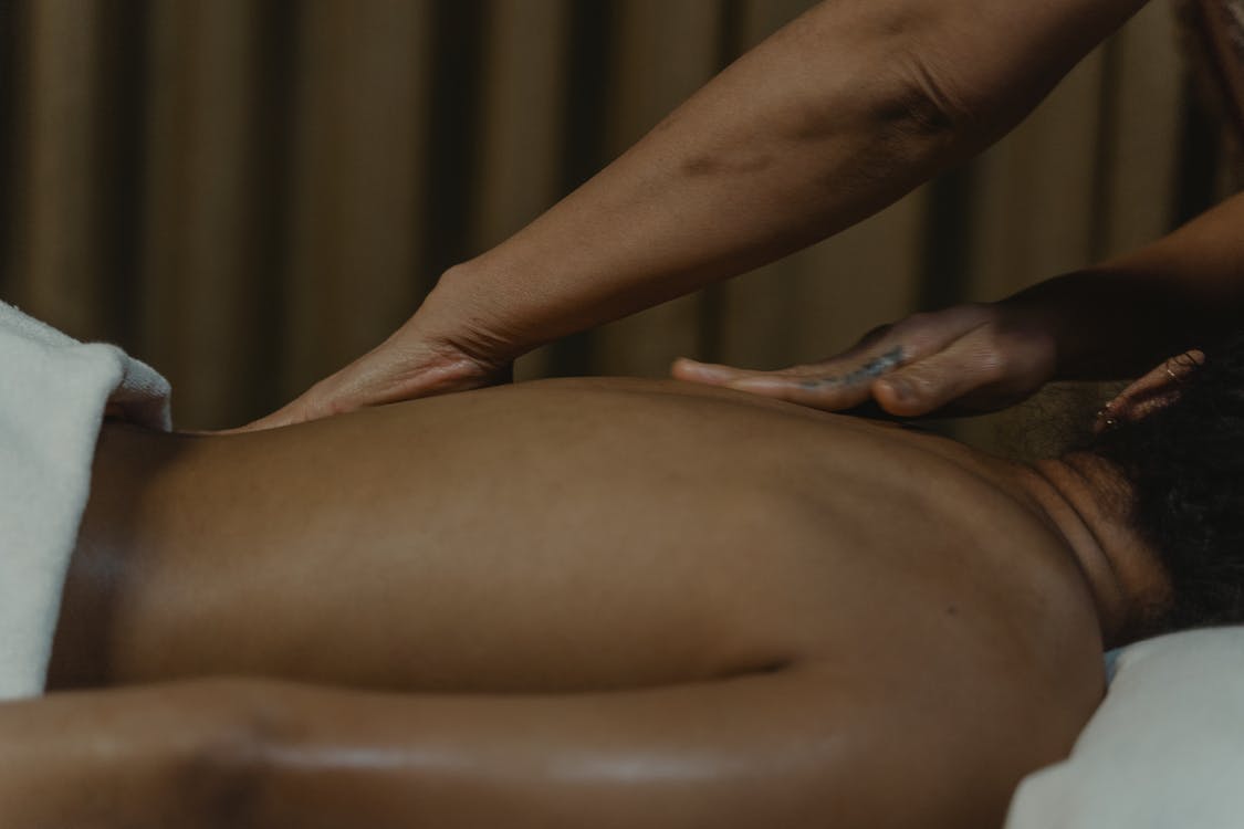 Reconnect with your partner by doing a massage at home. Photo from Pexels.