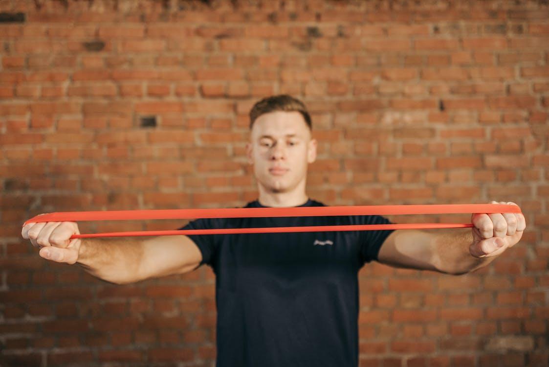 Resistance bands help you workout with resistance without using handheld weights. Photo from Pexels.