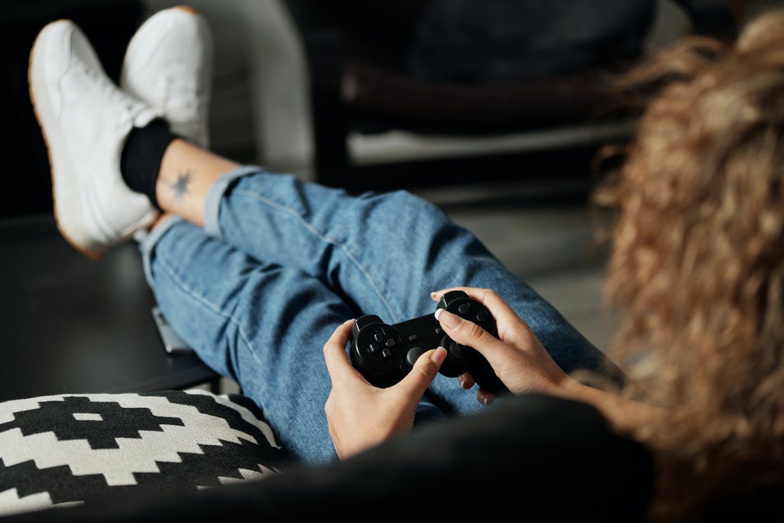 Sit back and have a blast during your gameplay. Photo from Pexels.