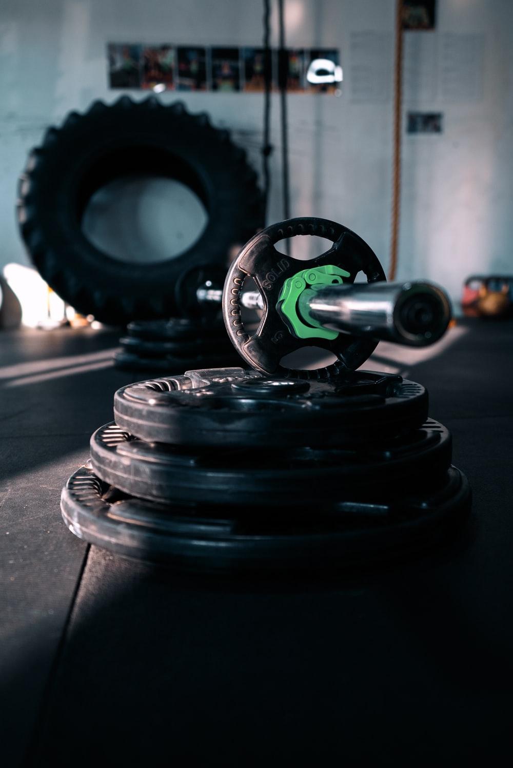 Weightlifting can be done at home with a barbell and a set of weight plates. Photo from Unsplash.