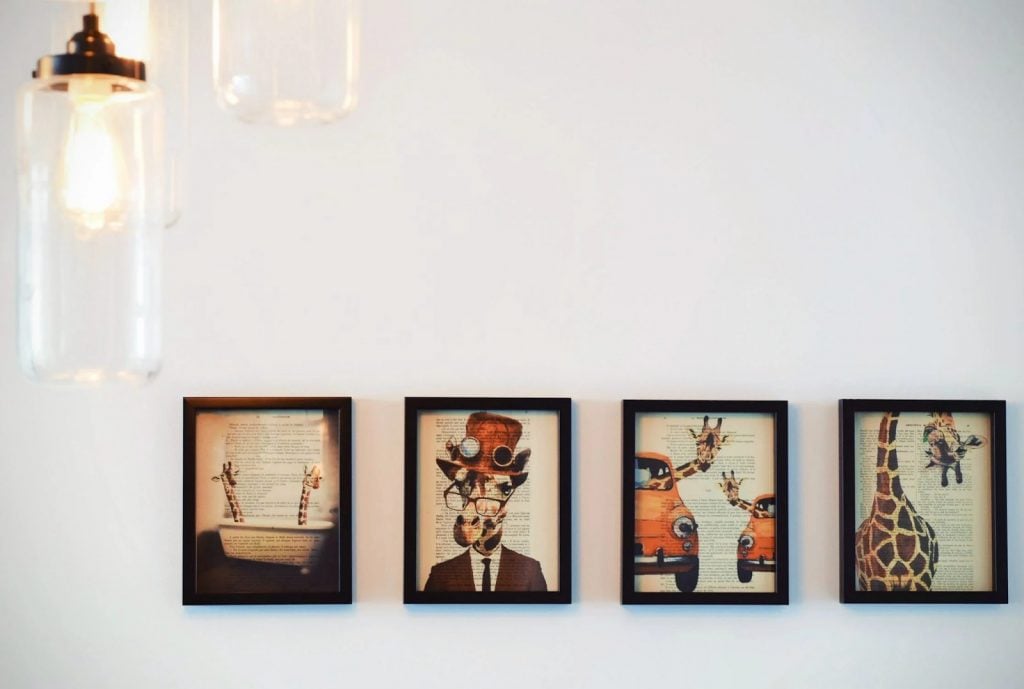 Photo of minimalist paintings on a neutral colored wall