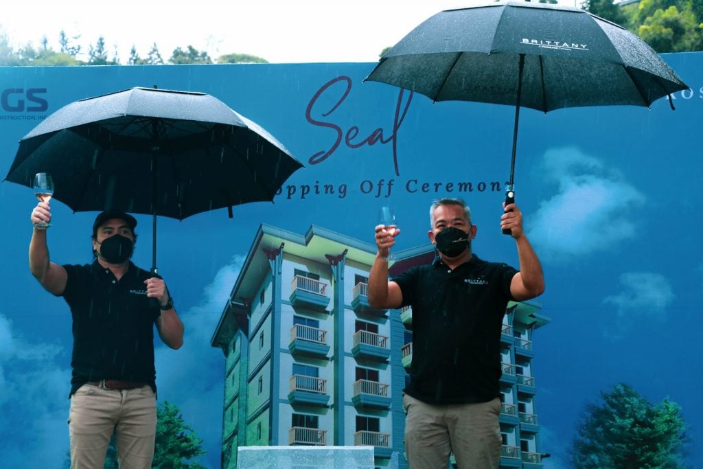 Brittany Corporation Division Heads Earl Millanes (left) and Romeo Sabater (right) gave a memorable toast for the topping-off event