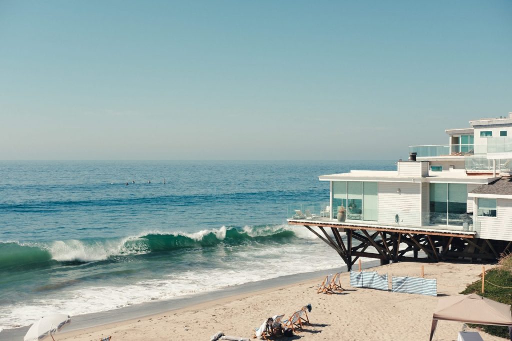 Beach houses are not only conventional whenever it is summer but on any time of the year as well. Photo from Unsplash