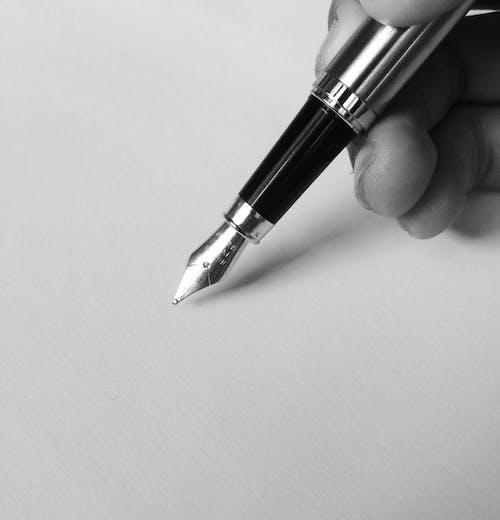 Free Person Holding Fountain Pen Stock Photo