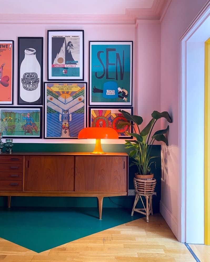 Image of colorful photos framed on the wall