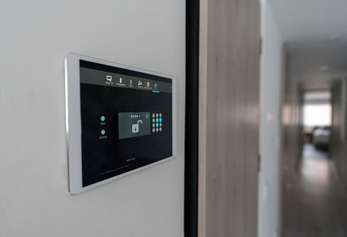 Close-up on an automated security system at a house locking the front door - smart home concepts