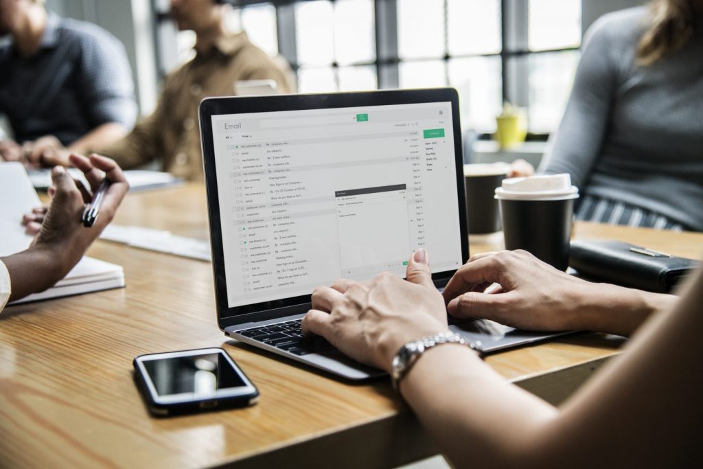 Woman checking her email in a meeting - Free Stock Photos - Life of Pix