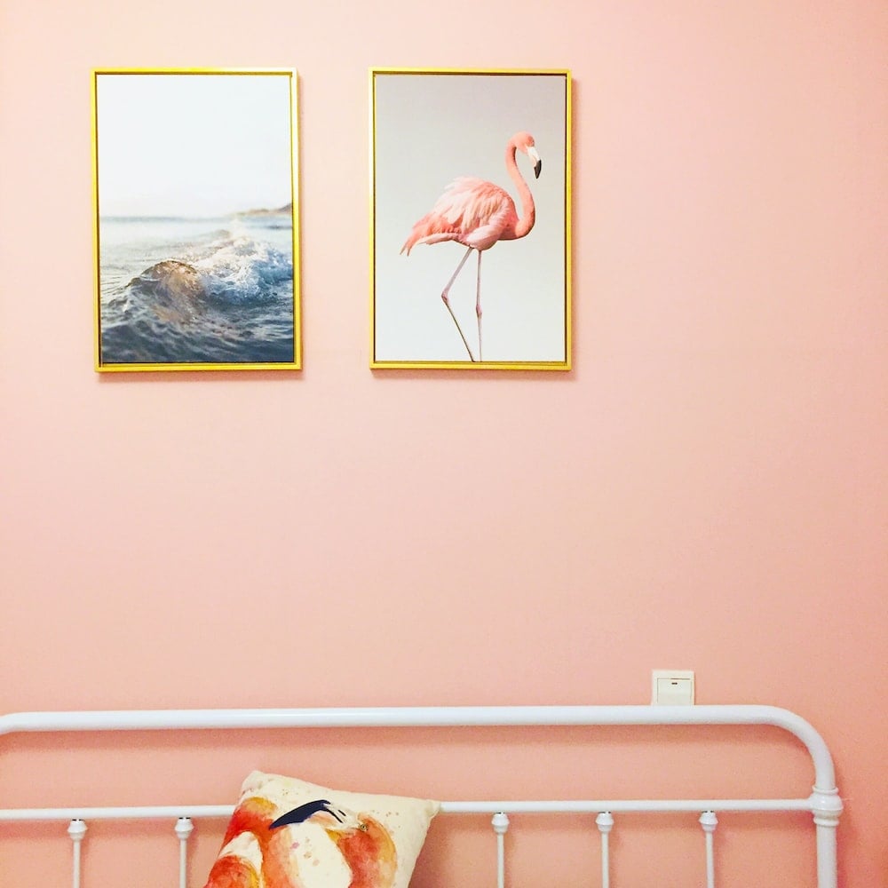 artwork flamingo illustration with brown frame on wall