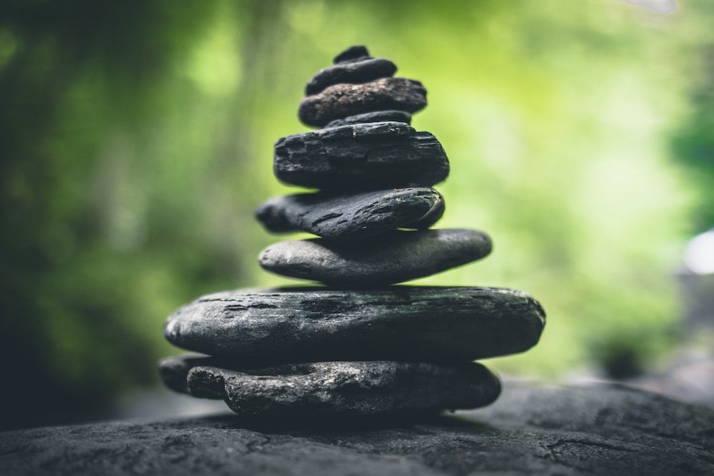 black stacking stones on gray surface zen garden