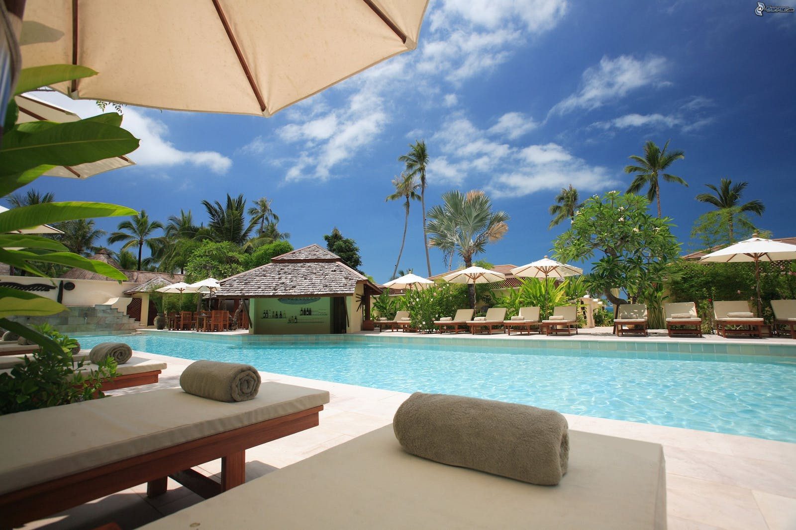 Photo of a resort pool and the blue sky on the background