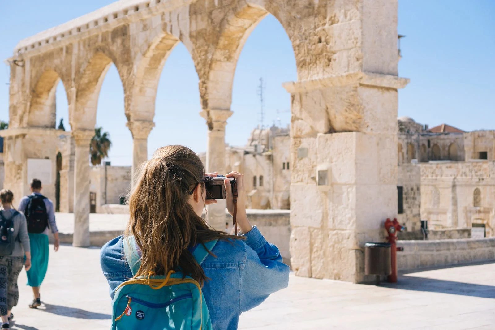 A girl taking photos of a tourist attraction