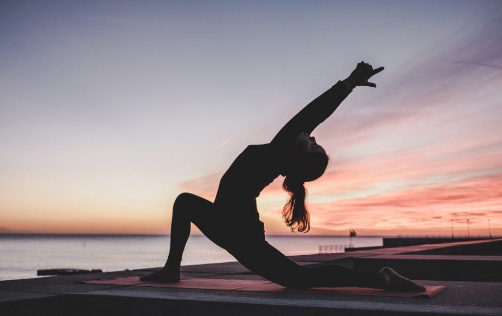 silhouette photography of woman doing yoga - Yoga is about finding your own rhythm, your own path.