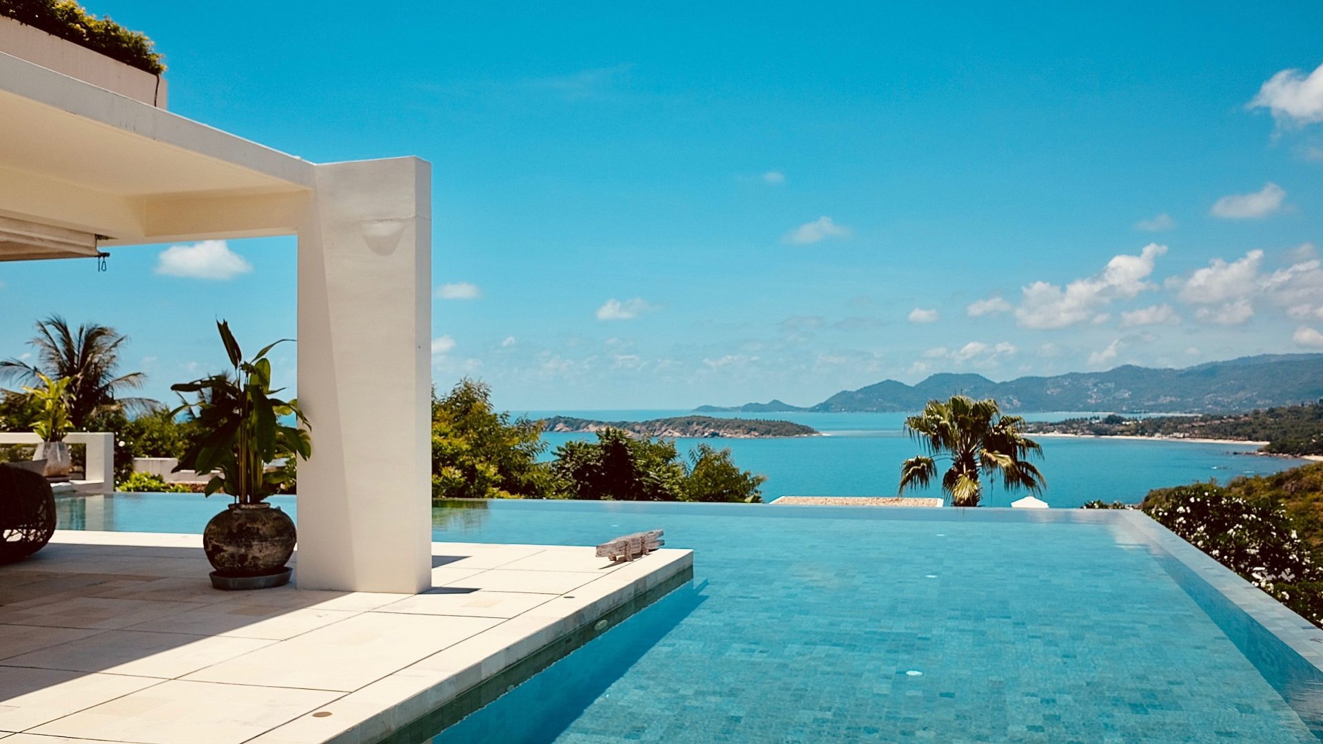 Infinity pool overlooking a beachfront view.