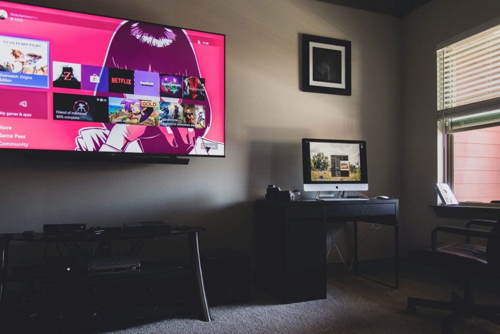 Home Design Shows to Binge-Watch This Weekend black flat screen tv turned on near black wooden table