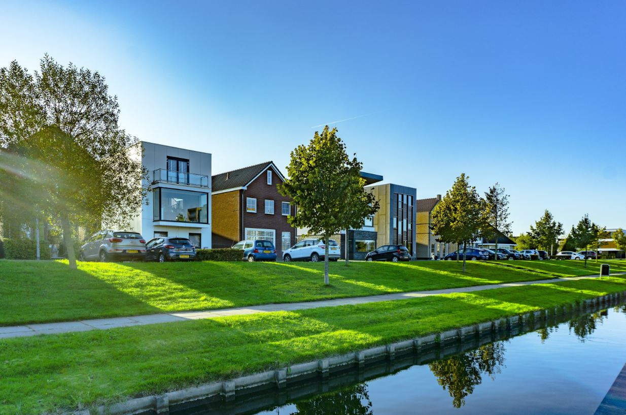 Photo of houses with huge green spaces