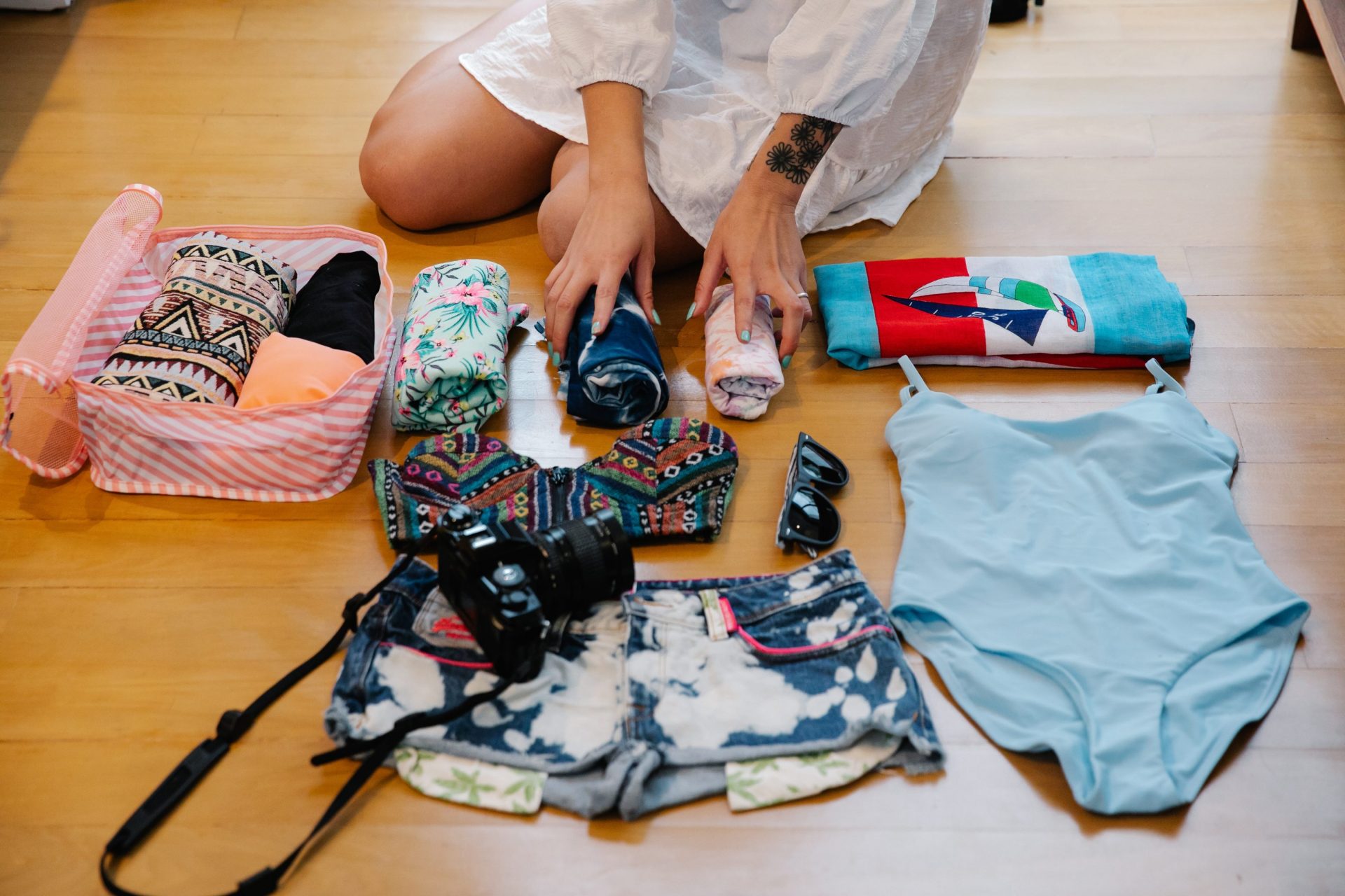 Photo of a girl packing up her things for travel