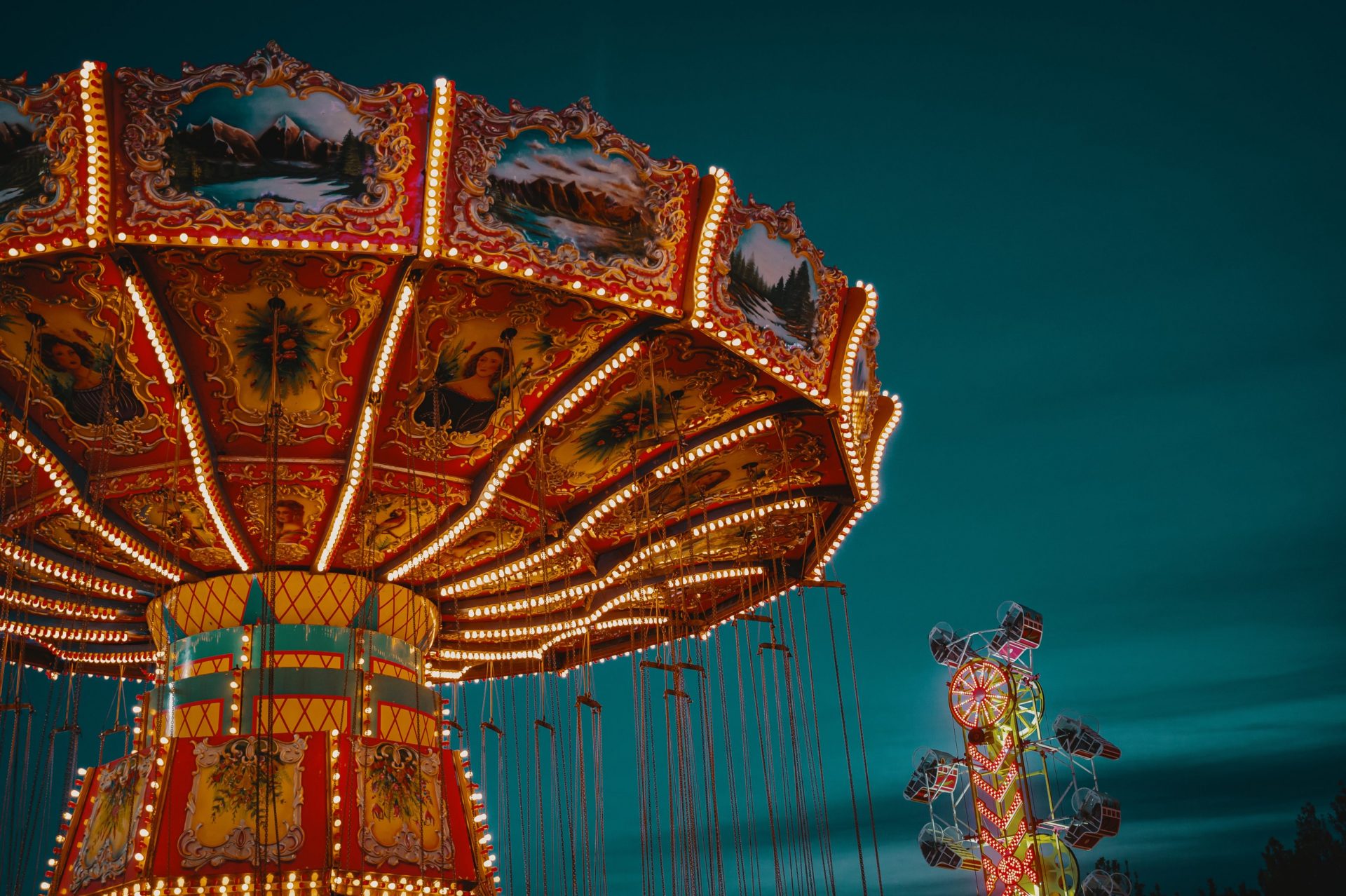 Photo of a theme park ride at night