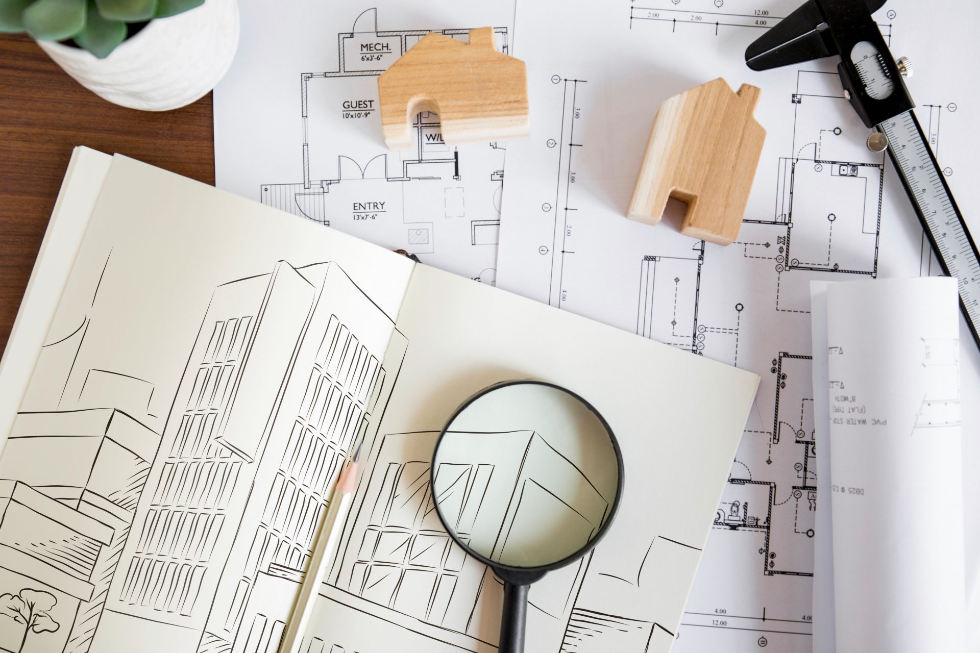 Photo of magnifying glass in a building drawing