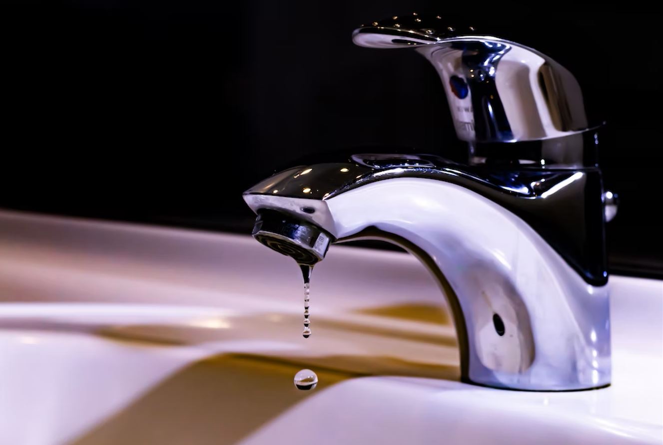 Photo of dripping water coming from the faucet