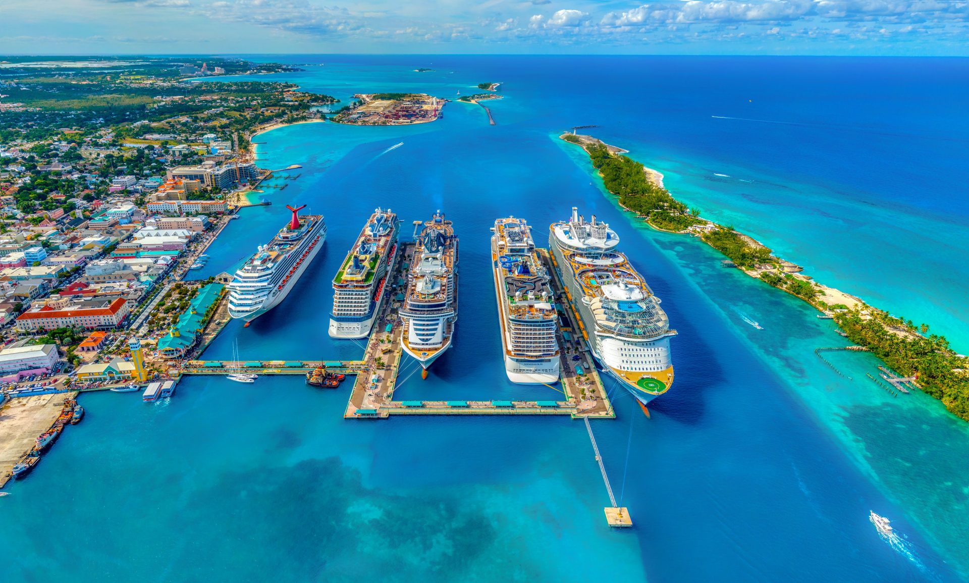 Photo of different iddling ships on port.