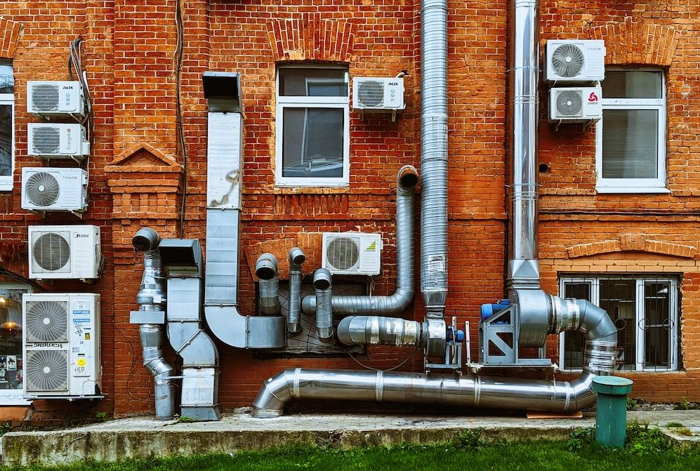 Photo of different pipes on the wall