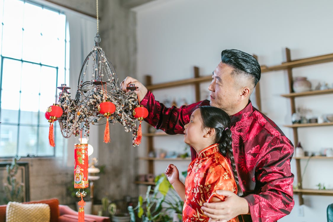 Photo of Chinese father and daughter decorating