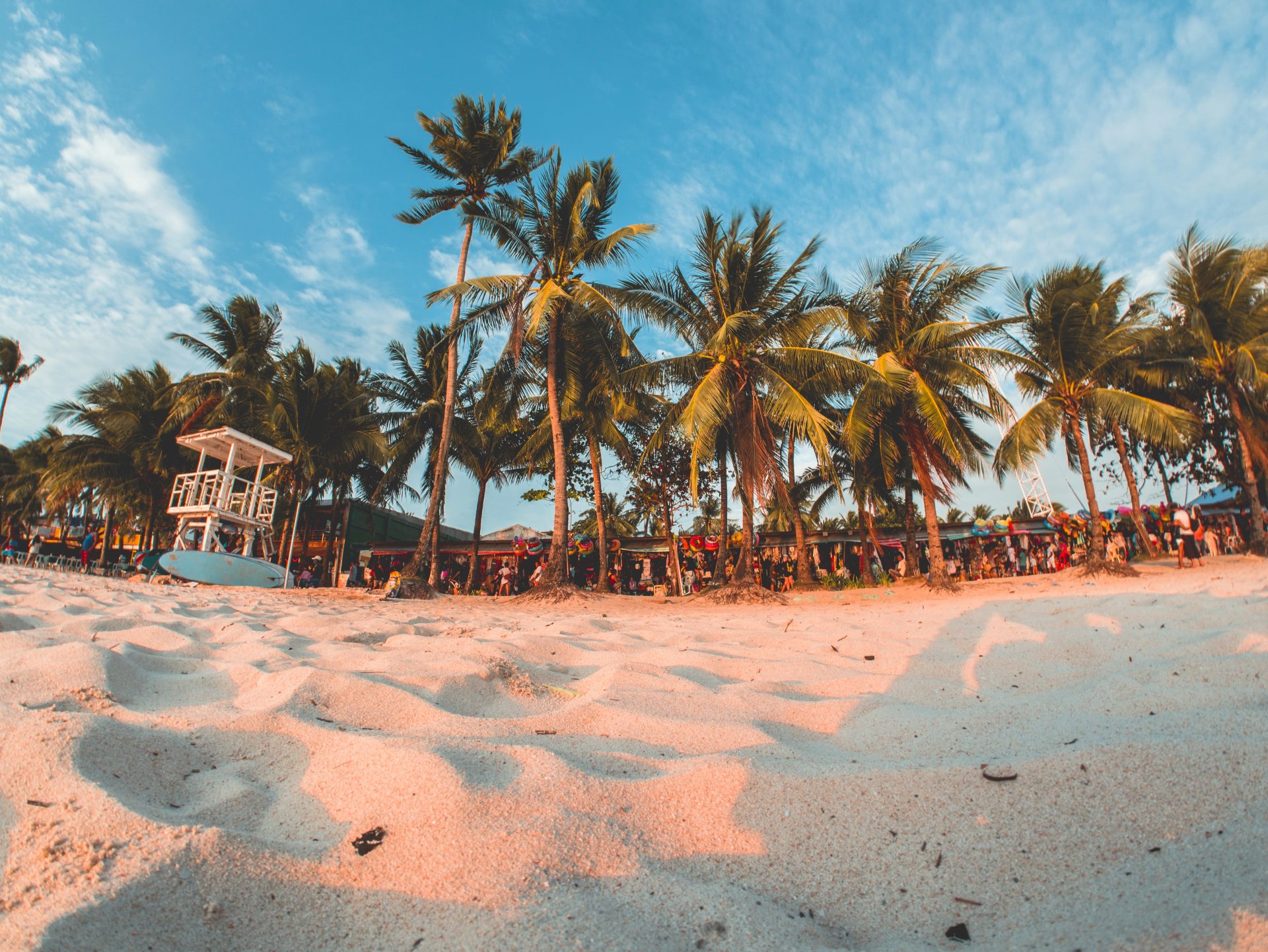 Photo of white sand and trees in Boracay