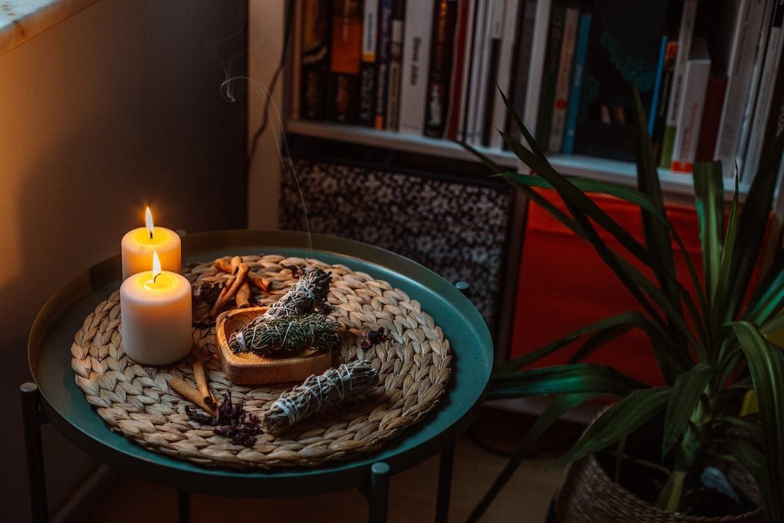 Photo of herb fragrance with candles on the table